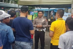 Kanit Regident Polres Malang Sosialisasikan Cara Pencegahan Virus Corona ke Wajib Pajak