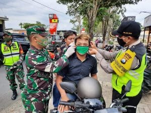 Sosialisasi New Normal, Koramil 0818/29 Dau Himbau Warga Patuhi Protokol Kesehatan